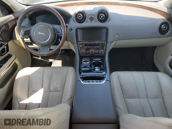 2014 Jaguar XJ with VIN SAJWA1CZ4E8V71167, listed as a Copart auction lot 43994545 with 69,682 mi miles and Salvage Title. Bid and sale history available at DreamBid. Image 8.