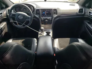 2018 Jeep Grand Cherokee Laredo E with VIN 1C4RJFAG6JC387334, listed as a Copart auction lot 64197034 with 57,992 mi miles and Salvage Title. Bid and sale history available at carsss.com. Image 8.