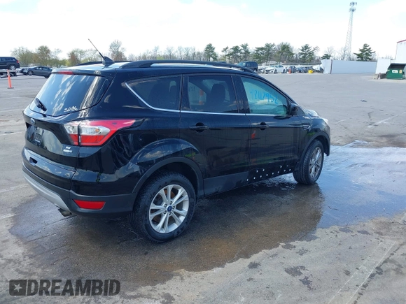 2018 Ford Escape SE z VIN 1FMCU9GD1JUD48846, wystawiony jako IAAI lot #42112952 z przebiegiem 117 580 mil mil oraz . Historia ofert i sprzedaży dostępna na DreamBid. Obrazek 4.