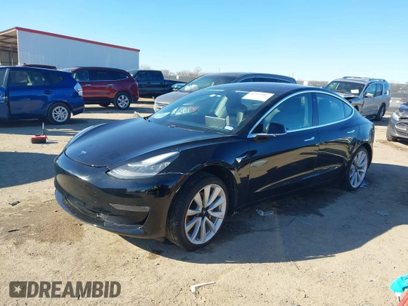 2018 Tesla Model 3 Long Range Battery with VIN 5YJ3E1EA2JF014975, listed as a IAAI auction lot 41319407 with 106,301 mi miles and . Bid and sale history available at DreamBid. Image 17.