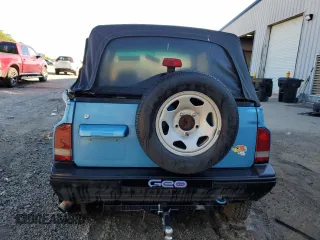 1995 Geo Tracker z VIN 2CNBE18U4S6948656, wystawiony jako Copart lot #76087194 z przebiegiem 163 080 mil mil oraz Szkody całkowita. Historia ofert i sprzedaży dostępna na DreamBid. Obrazek 6.