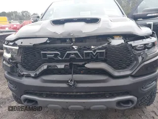 2022 Ram 1500 TRX with VIN 1C6SRFU9XNN476106, listed as a IAAI auction lot 41627895 with 21,992 mi miles and . Bid and sale history available at DreamBid. Image 6.
