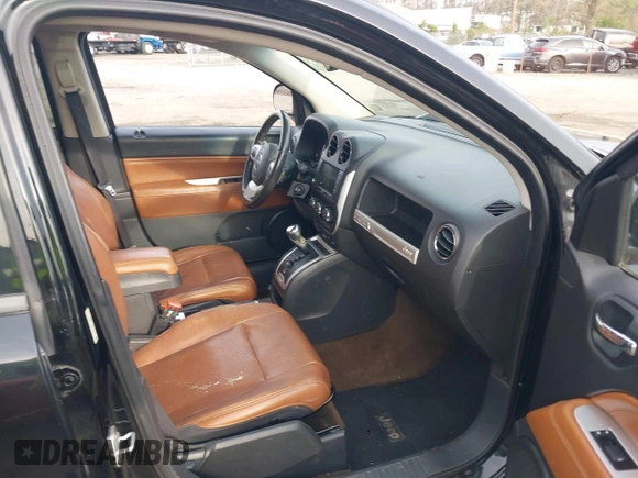 2014 Jeep Compass Limited with VIN 1C4NJDCB9ED549543, listed as a IAAI auction lot 41938699 with 195,973 mi miles. Bid and sale history available at carsss.com. Image 5.