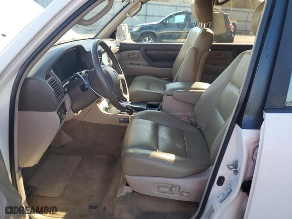 1999 Toyota Land Cruiser with VIN JT3HT05J8X0049750, listed as a Copart auction lot 77547144 with 168,435 mi miles and Salvage Title. Bid and sale history available at carsss.com. Image 7.