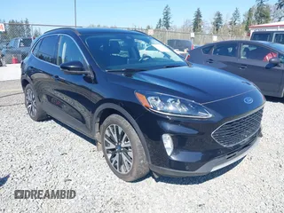 2020 Ford Escape Titanium Hybrid z VIN 1FMCU9DZ9LUC35844, wystawiony jako IAAI lot #42058275 z przebiegiem 74 205 mil mil oraz . Historia ofert i sprzedaży dostępna na DreamBid. Obrazek 1.