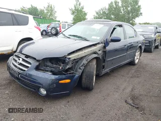 2002 Nissan Maxima GXE with VIN JN1DA31D72T410204, listed as a IAAI auction lot 42515430 with 91,406 mi miles and . Bid and sale history available at DreamBid. Image 2.