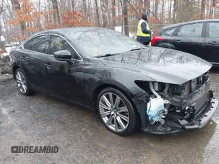2018 Mazda 6 Grand Touring Reserve with VIN JM1GL1WY1J1308749, listed as a IAAI auction lot 41571220 with 113,041 mi miles and . Bid and sale history available at carsss.com. Image 1.