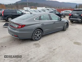 2022 Hyundai Sonata Hybrid Blue with VIN KMHL24JJ2NA048439, listed as a IAAI auction lot 40942477 with 64,855 mi miles. Bid and sale history available at carsss.com. Image 4.