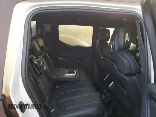 2023 Rivian R1T Adventure z VIN 7FCTGBAA6PN028517, wystawiony jako Copart lot #73712354 z przebiegiem Nie podano mil oraz Nie do naprawy. Historia ofert i sprzedaży dostępna na DreamBid. Obrazek 11.