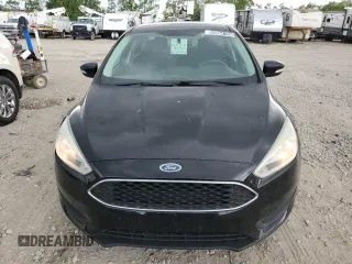 2017 Ford Focus SE z VIN 1FADP3F29HL291329, wystawiony jako Copart lot #58964155 z przebiegiem 102 506 mil mil oraz Czysty tytuł • Clean title. Historia ofert i sprzedaży dostępna na DreamBid. Obrazek 5.