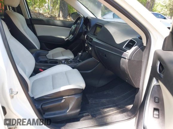 2016 Mazda CX-5 Grand Touring with VIN JM3KE2DY0G0870077, listed as a IAAI auction lot 42158225 with 93,816 mi miles. Bid and sale history available at carsss.com. Image 5.