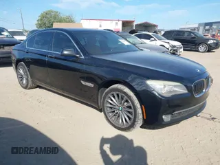 2012 BMW 7 Series 740i with VIN WBAKA4C51CC613636, listed as a IAAI auction lot 41908801 with 127,725 mi miles. Bid and sale history available at carsss.com. Image 1.