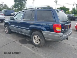 2002 Jeep Grand Cherokee Laredo with VIN 1J4GX48S02C125258, listed as a IAAI auction lot 42388724 with 295,270 mi miles and . Bid and sale history available at DreamBid. Image 3.