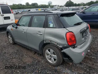 2016 MINI Hardtop 4 Door with VIN WMWXU1C53G2D08231, listed as a Copart auction lot 61050035 with 128,267 mi miles and Salvage title. Bid and sale history available at DreamBid. Image 2.