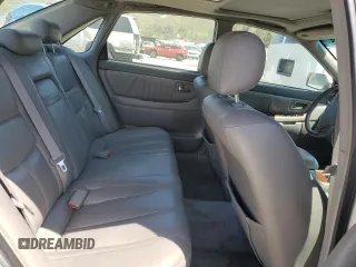 2001 Toyota Avalon XL z VIN 4T1BF28B11U154831, wystawiony jako Copart lot #57131435 z przebiegiem 211 745 mil mil oraz Szkody całkowita. Historia ofert i sprzedaży dostępna na DreamBid. Obrazek 10.