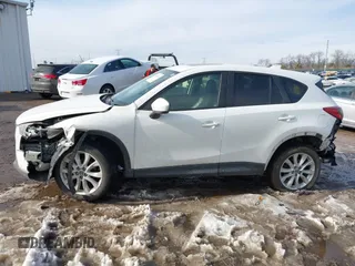 2014 Mazda CX-5 Grand Touring with VIN JM3KE4DY9E0300491, listed as a IAAI auction lot 41657153 with 157,394 mi miles and . Bid and sale history available at DreamBid. Image 14.
