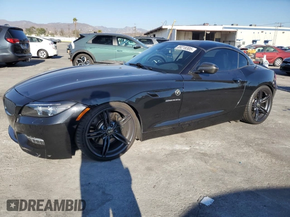 2011 BMW Z4 sDrive35is with VIN WBALM1C58BE393909, listed as a Copart auction lot 89218305 with 112,502 mi miles and Salvage title. Bid and sale history available at DreamBid. Image 1.