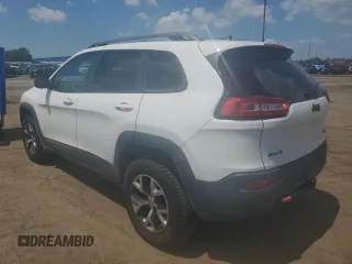 2015 Jeep Cherokee Trailhawk with VIN 1C4PJMBSXFW651000, listed as a Copart auction lot 64110515 with 135,571 mi miles and Clean title. Bid and sale history available at DreamBid. Image 2.