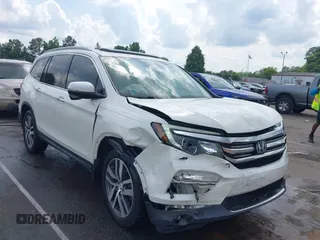 2017 Honda Pilot Touring с VIN 5FNYF6H94HB060660, выставлен на аукционе IAAI как лот 42499290 с пробегом 135 517 миль миль и . История ставок и продаж доступна на DreamBid. Изображение 1.