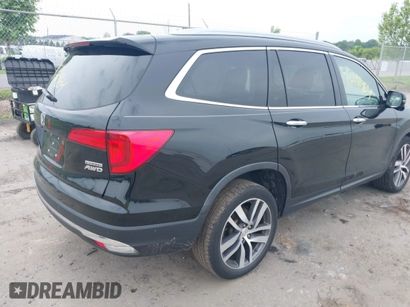 2017 Honda Pilot Touring with VIN 5FNYF6H90HB052474, listed as a IAAI auction lot 42291464 with 103,288 mi miles and . Bid and sale history available at DreamBid. Image 4.