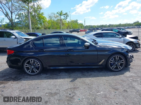 2019 BMW 5 Series M550i xDrive with VIN WBAJB9C51KB289355, listed as a IAAI auction lot 41867984 with 30,106 mi miles and . Bid and sale history available at DreamBid. Image 13.