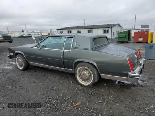 1984 Cadillac Eldorado z VIN 1G6AL5781EE619594, wystawiony jako Copart lot #80918934 z przebiegiem 47 529 mil mil oraz Szkody całkowita. Historia ofert i sprzedaży dostępna na DreamBid. Obrazek 2.
