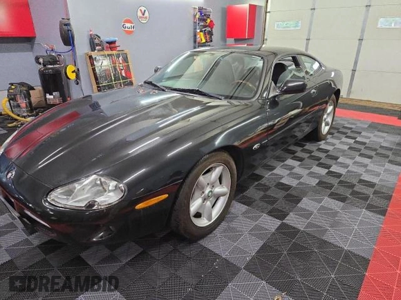 1997 Jaguar XK with VIN SAJGX5748VC006720, listed as a Copart auction lot 80928284 with 96,279 mi miles and Clean Title. Bid and sale history available at DreamBid. Image 2.
