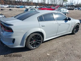 2022 Dodge Charger Scat Pack Widebody with VIN 2C3CDXGJ6NH176650, listed as a IAAI auction lot 41863122 with 34,569 mi miles and . Bid and sale history available at DreamBid. Image 4.