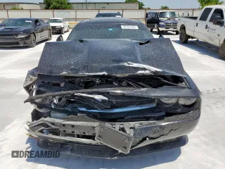 2014 Dodge Challenger R/T Plus z VIN 2C3CDYBT0EH122467, wystawiony jako Copart lot #58392365 z przebiegiem 136 793 mil mil oraz Szkoda całkowita • Salvage title. Historia ofert i sprzedaży dostępna na DreamBid. Obrazek 5.