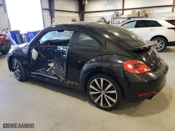 2012 Volkswagen Beetle 2.0T Black Turbo Launch Edition PZEV with VIN 3VWVA7AT4CM604847, listed as a Copart auction lot 88374685 with 135,278 mi miles and Salvage Title. Bid and sale history available at carsss.com. Image 2.