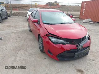 2019 Toyota Corolla L with VIN 5YFBURHEXKP882871, listed as a IAAI auction lot 41747710 with 104,117 mi miles. Bid and sale history available at carsss.com. Image 1.