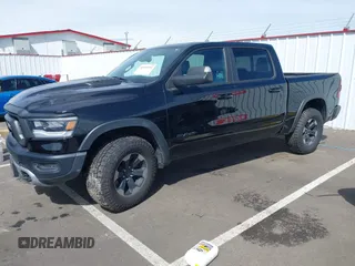 2019 Ram 1500 Rebel with VIN 1C6SRFLT2KN592652, listed as a IAAI auction lot 41989054 with 71,630 mi miles and . Bid and sale history available at DreamBid. Image 17.