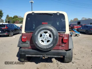 2002 Jeep Wrangler Sahara with VIN 1J4FA59S22P704603, listed as a Copart auction lot 77554334 with 99,758 mi miles and Salvage Title. Bid and sale history available at carsss.com. Image 6.