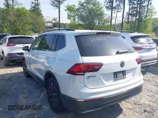 2021 Volkswagen Tiguan SE with VIN 3VV3B7AX7MM080266, listed as a IAAI auction lot 42062147 with 66,786 mi miles and . Bid and sale history available at DreamBid. Image 3.