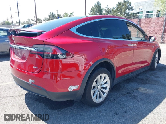 2016 Tesla Model X 70D with VIN 5YJXCAE23GF002262, listed as a IAAI auction lot 41839084 with 173,658 mi miles. Bid and sale history available at carsss.com. Image 4.