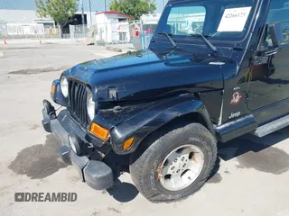 2001 Jeep Wrangler Sahara z VIN 1J4FA59S41P313113, wystawiony jako IAAI lot #42266173 z przebiegiem 125 792 mil mil oraz . Historia ofert i sprzedaży dostępna na DreamBid. Obrazek 6.