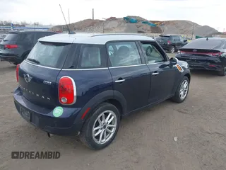 2015 MINI Countryman z VIN WMWZB3C56FWR44706, wystawiony jako IAAI lot #41921628 z przebiegiem 128 530 mil mil oraz . Historia ofert i sprzedaży dostępna na DreamBid. Obrazek 4.