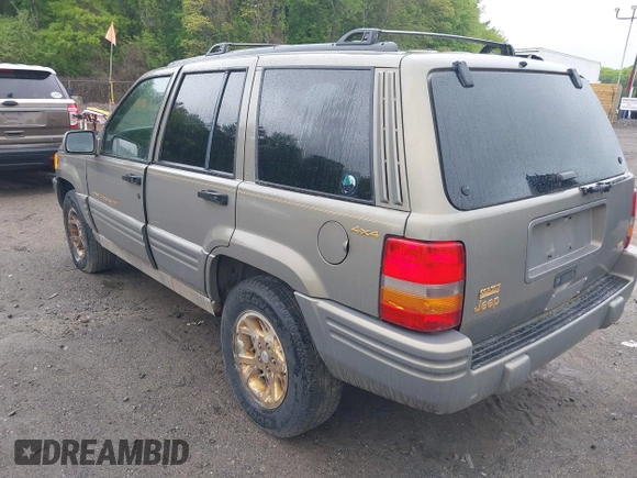 1998 Jeep Grand Cherokee Limited z VIN 1J4GZ78Y5WC261391, wystawiony jako IAAI lot #42275913 z przebiegiem 180 552 mil mil oraz . Historia ofert i sprzedaży dostępna na DreamBid. Obrazek 3.