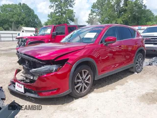 2018 Mazda CX-5 Grand Touring with VIN JM3KFADM4J0335913, listed as a IAAI auction lot 42326044 with 104,583 mi miles and . Bid and sale history available at DreamBid. Image 18.