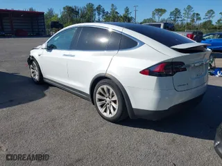 2016 Tesla Model X P90D with VIN 5YJXCAE4XGF000915, listed as a IAAI auction lot 41278587 with 98,728 mi miles. Bid and sale history available at carsss.com. Image 3.