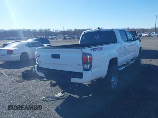 2021 Toyota Tacoma 4WD SR5 with VIN 3TYDZ5BN4MT000619, listed as a IAAI auction lot 41886686 with 91,338 mi miles. Bid and sale history available at carsss.com. Image 4.