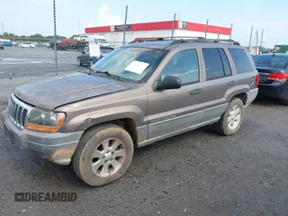 2001 Jeep Grand Cherokee Laredo z VIN 1J4GX48N51C548958, wystawiony jako IAAI lot #42460303 z przebiegiem 210 379 mil mil oraz . Historia ofert i sprzedaży dostępna na DreamBid. Obrazek 2.