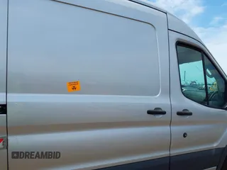 2015 Ford Transit Cargo z VIN 1FTNR2CM9FKB05431, wystawiony jako IAAI lot #42486662 z przebiegiem Nie podano mil oraz . Historia ofert i sprzedaży dostępna na DreamBid. Obrazek 8.