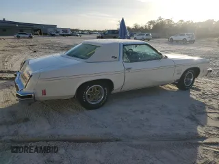 1975 Oldsmobile Cutlass z VIN 3J57T5M323248, wystawiony jako Copart lot #80526124 z przebiegiem 13 934 mil mil oraz Szkody całkowita. Historia ofert i sprzedaży dostępna na DreamBid. Obrazek 3.