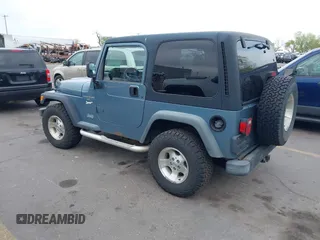 1998 Jeep Wrangler Sport with VIN 1J4FY19S8WP781437, listed as a IAAI auction lot 42096647 with 245,900 mi miles. Bid and sale history available at carsss.com. Image 3.