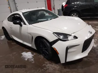 2023 Toyota 86 Premium z VIN JF1ZNBE1XP9765718, wystawiony jako IAAI lot #41945549 z przebiegiem 12 942 mil mil oraz . Historia ofert i sprzedaży dostępna na DreamBid. Obrazek 1.