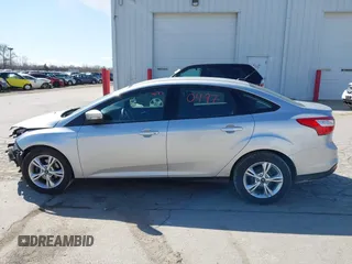 2013 Ford Focus SE z VIN 1FADP3F23DL306241, wystawiony jako IAAI lot #41980497 z przebiegiem 63 313 mil mil oraz . Historia ofert i sprzedaży dostępna na DreamBid. Obrazek 15.