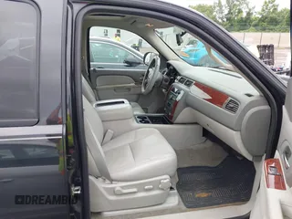 2011 Chevrolet Suburban with VIN 1GNWKMEG1BR374950, listed as a IAAI auction lot 42781182 with 304,690 mi miles and . Bid and sale history available at DreamBid. Image 5.