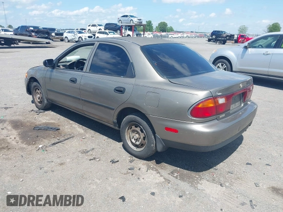 1997 Mazda Protege DX with VIN JM1BC1416V0132633, listed as a IAAI auction lot 42162630 with 234,300 mi miles and . Bid and sale history available at DreamBid. Image 3.