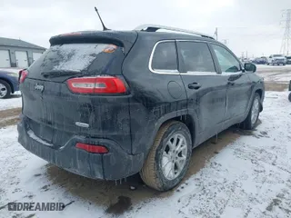 2015 Jeep Cherokee Latitude with VIN 1C4PJLCB3FW690116, listed as a IAAI auction lot 41612425 with 181,061 mi miles. Bid and sale history available at carsss.com. Image 4.